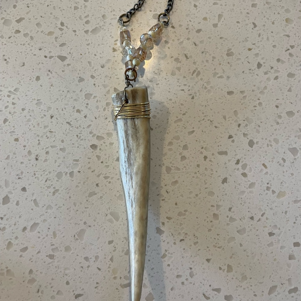 Naturally shed deer antler charm necklace.